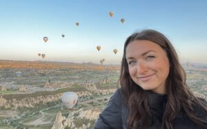 Kaitlyn on a hot air balloon at sunrise in Cappadocia, Turkey