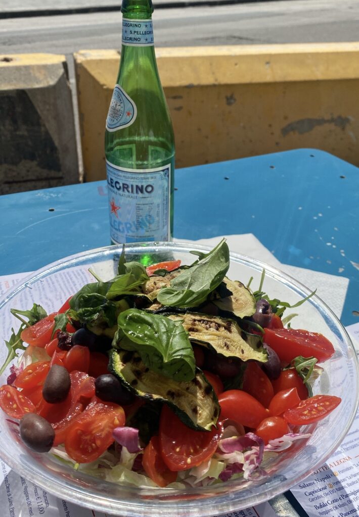 mineral water and salad for lunch in italy