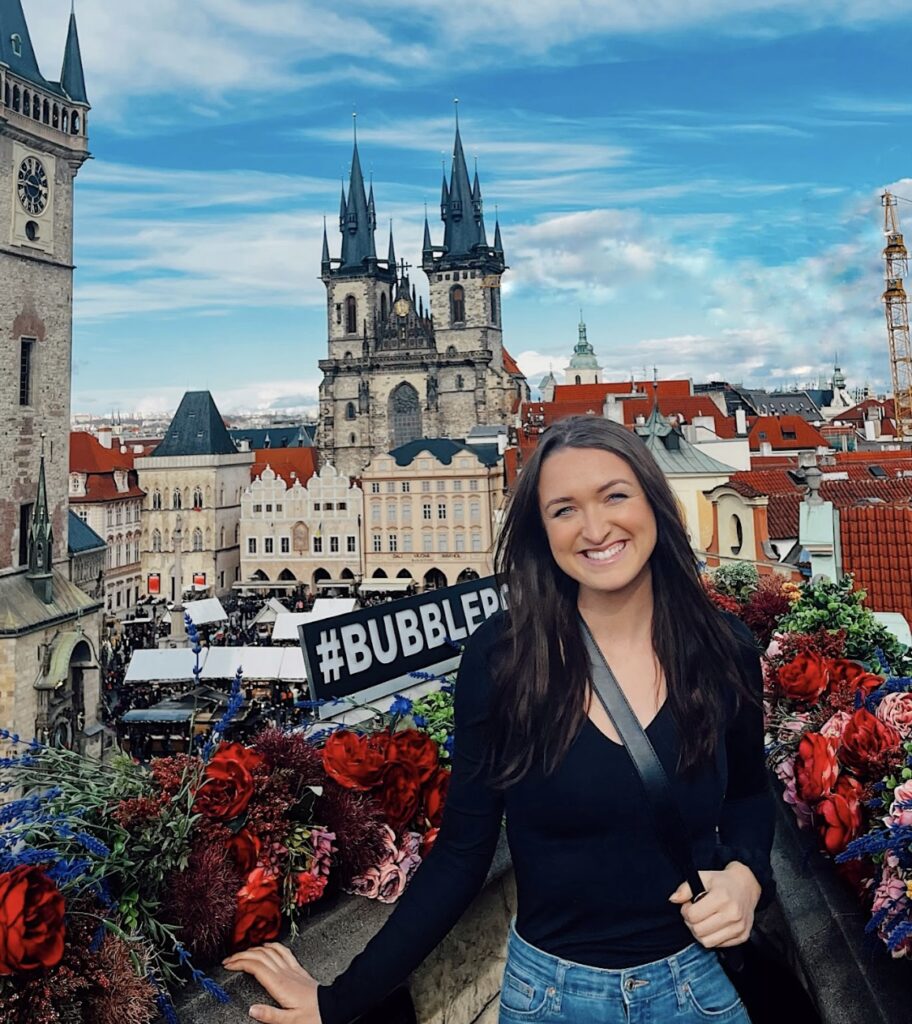 Kaitlyn posing in front of old town prague buildings at teresa u prince